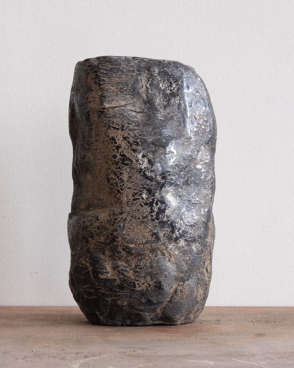 Wheel of Matter by Arran Gregory, seen from another side, showing its pale scratched surface