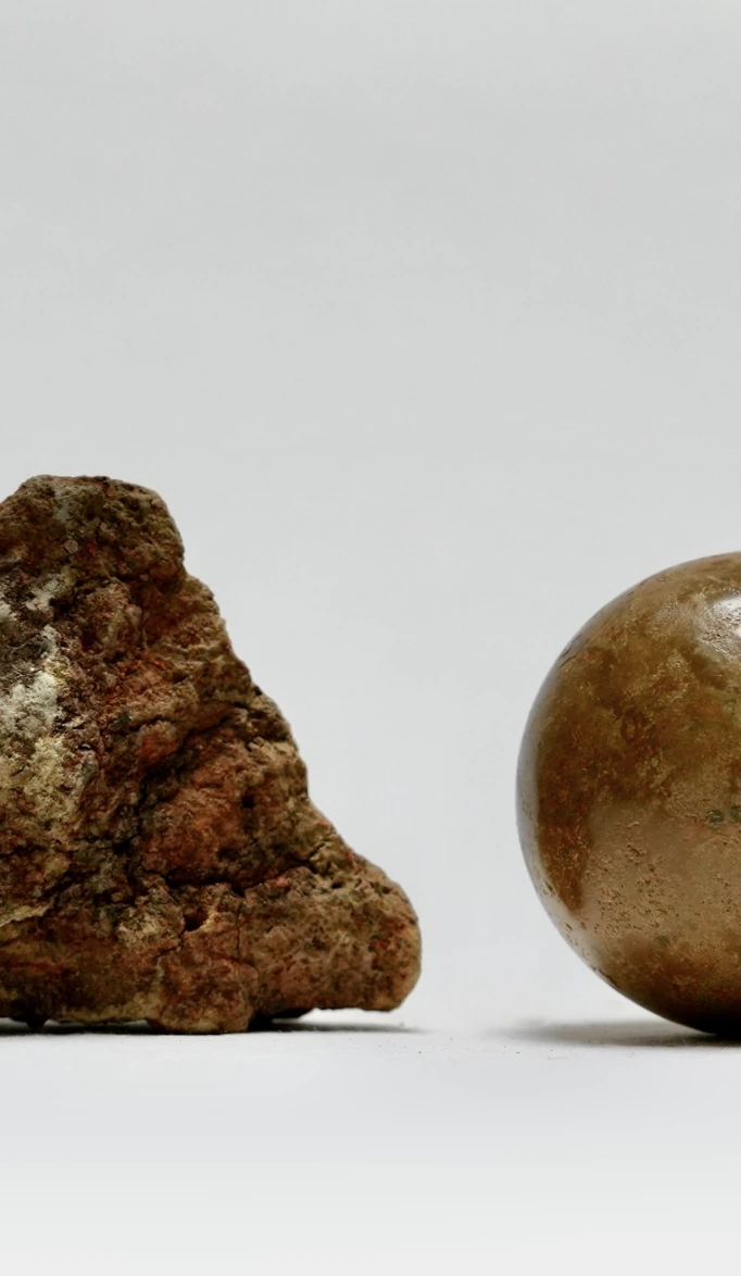 Portrait crop of the rock and sphere in Earth Memory by Edie Evans