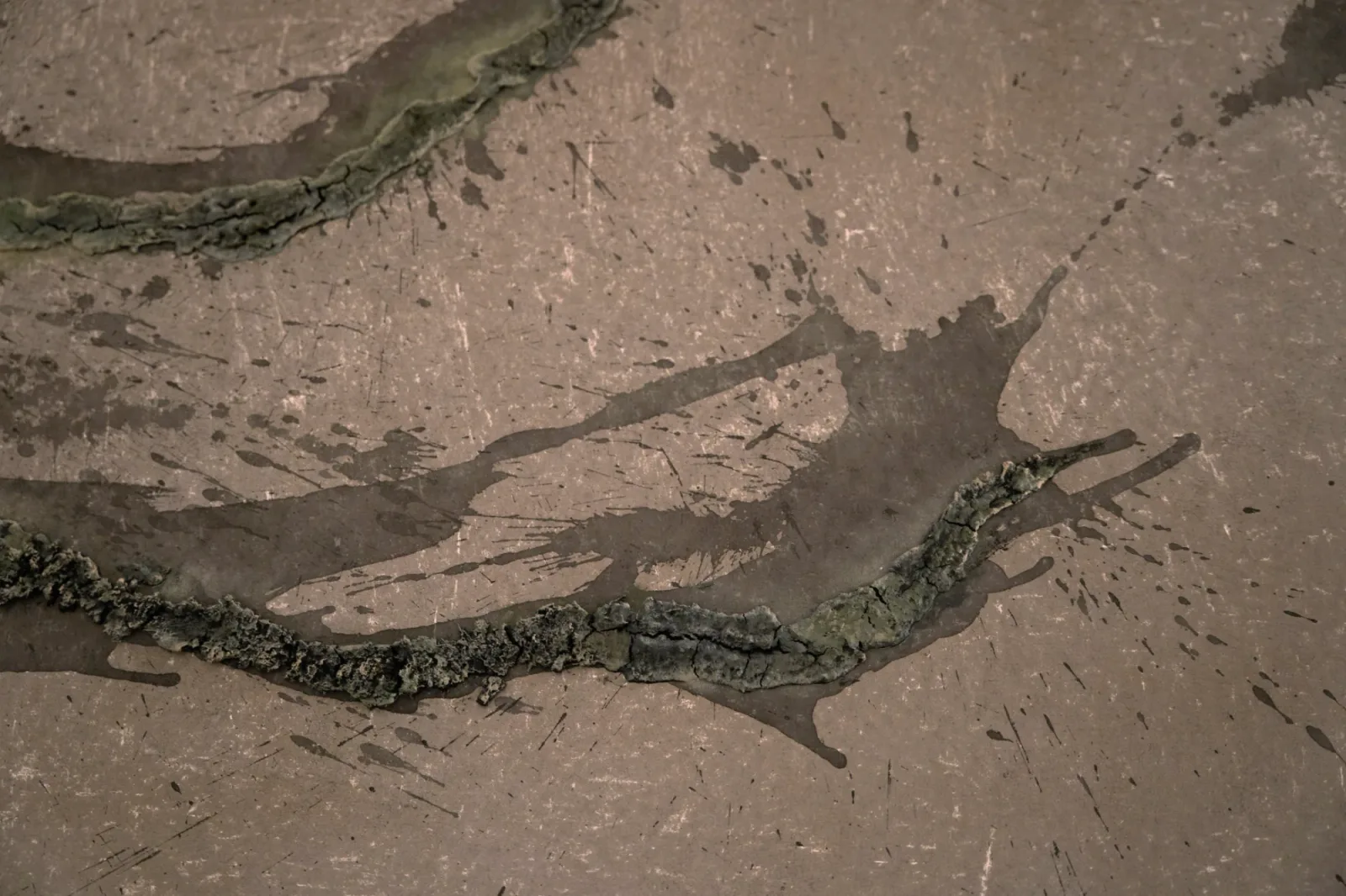 Close-up of Unearthing Series #3 by Eleanor Herbosch showing cracked ridges of raised London Clay and dark splashes