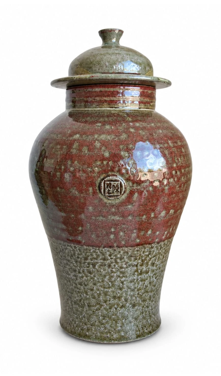 Ginger Jar by Jacob Chan, a lidded jar with a glossy red shoulder above a speckled green base