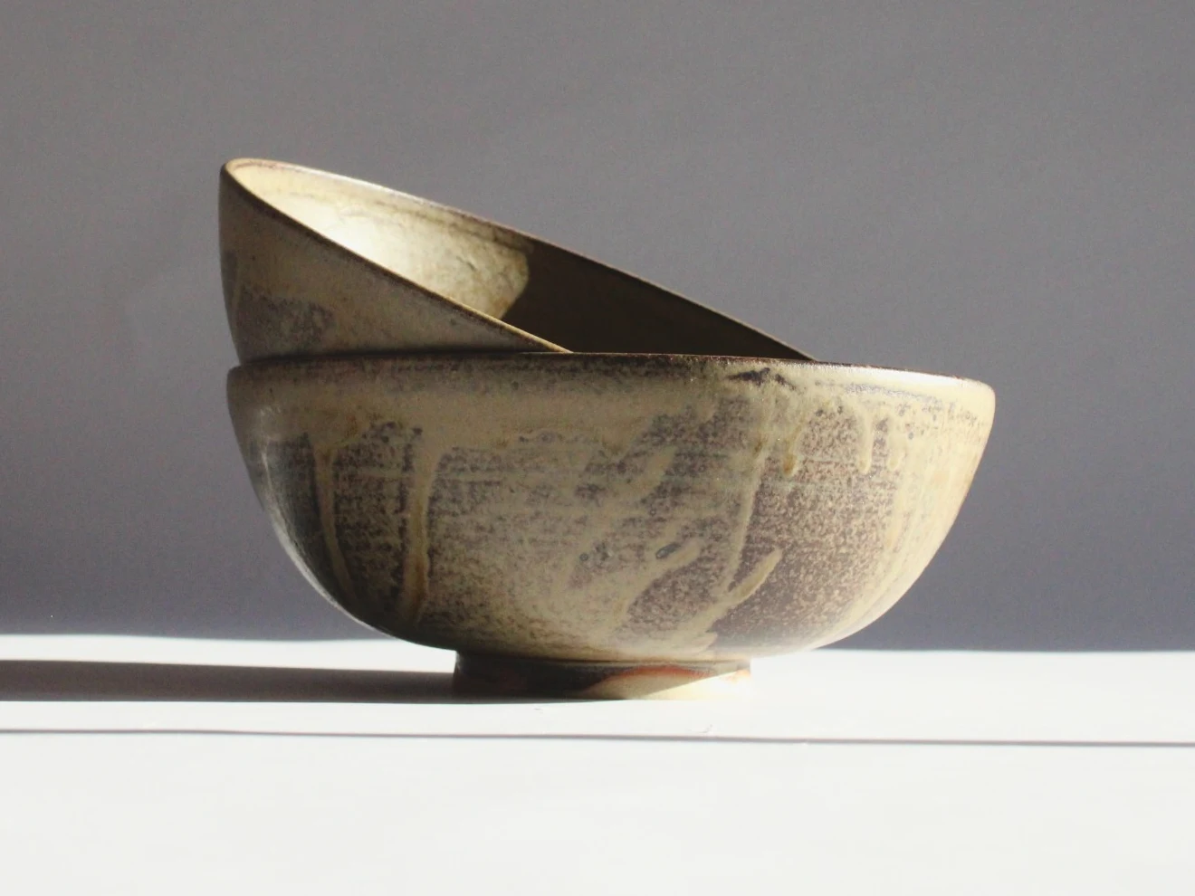 Large Bowl by James Galbraith Kirkpatrick, the stacked bowls from another side showing drips of pale glaze
