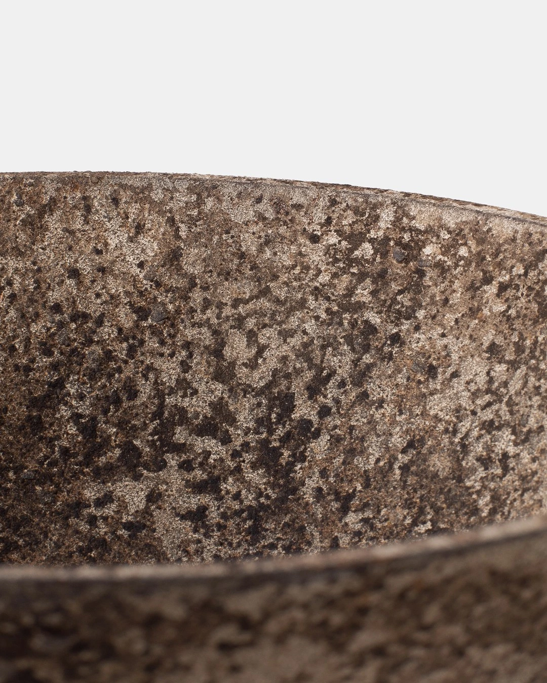 Close-up of the rim of Bowl II by Louis Vincent showing the speckled clay surface
