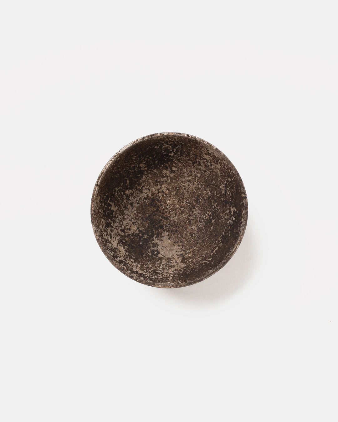 Bowl III by Louis Vincent seen from above, showing its dark mottled interior