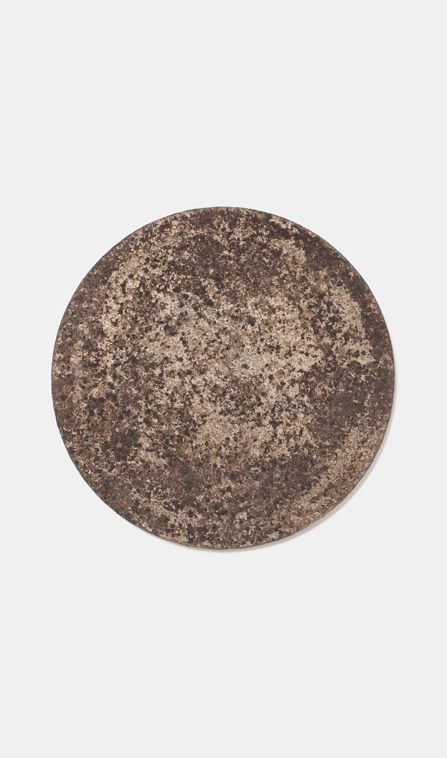 Plate IV by Louis Vincent seen from above, a flat disc with a light mottled clay surface