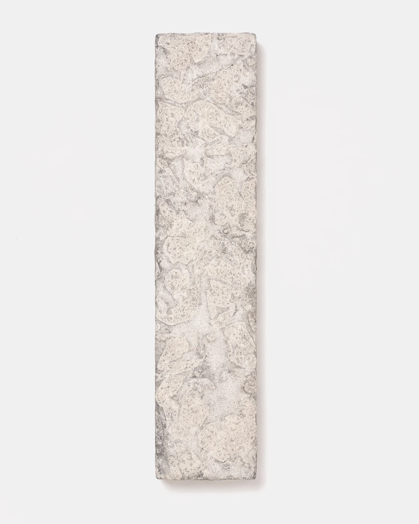 Wall Panel III by Louis Vincent, a narrow pale panel with a cream and grey textured clay surface