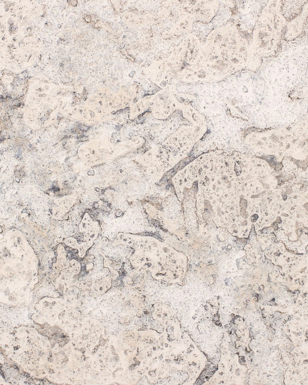 Close-up of the textured clay surface of Wall Panel IV by Louis Vincent