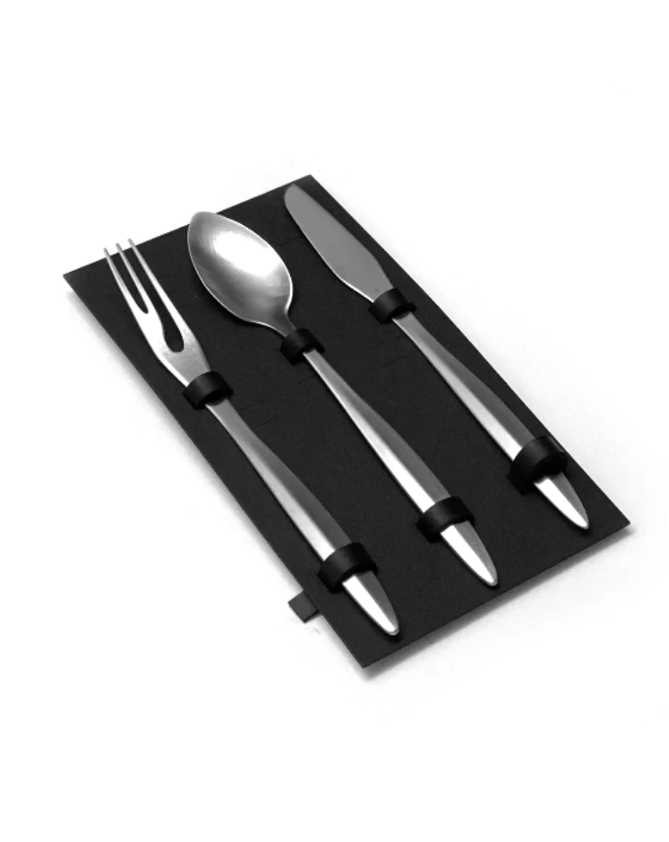 Cutlery Set by Rickie Cheuk, a stainless steel fork, spoon and knife held in a black leather roll